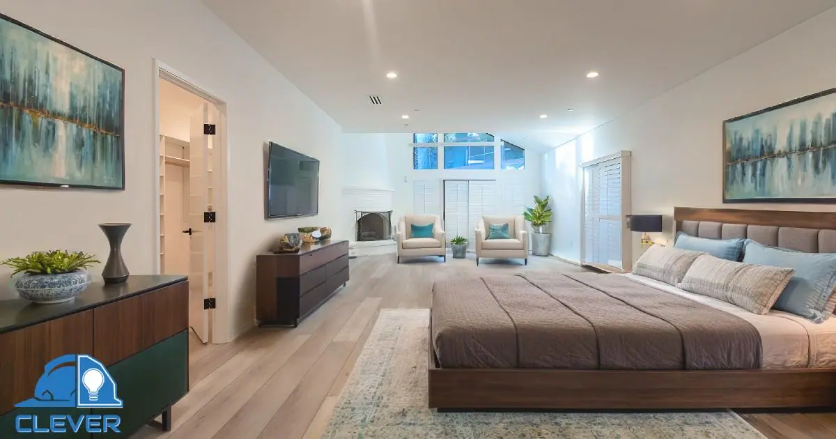 Master bedroom with hardwood floors and large windows