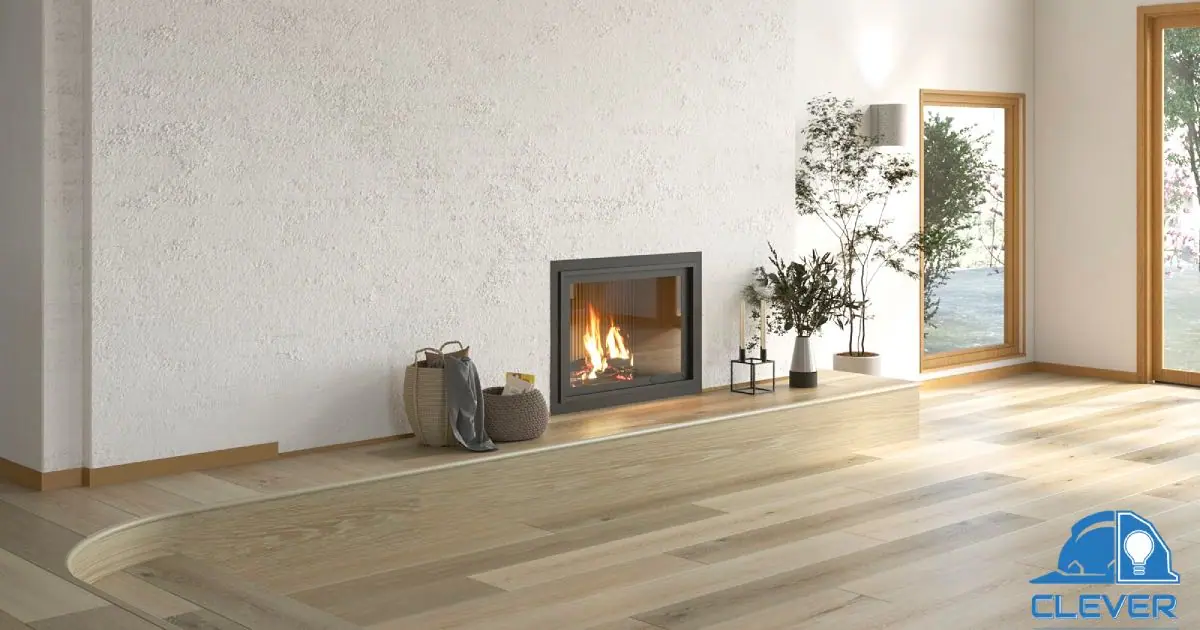 Sunken living area with a modern fireplace and wide-plank floors