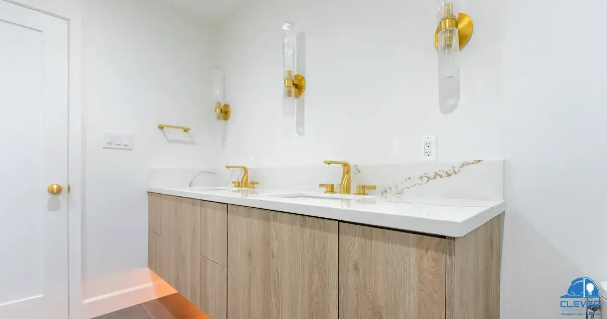 Vanity with gold wall-mounted faucet