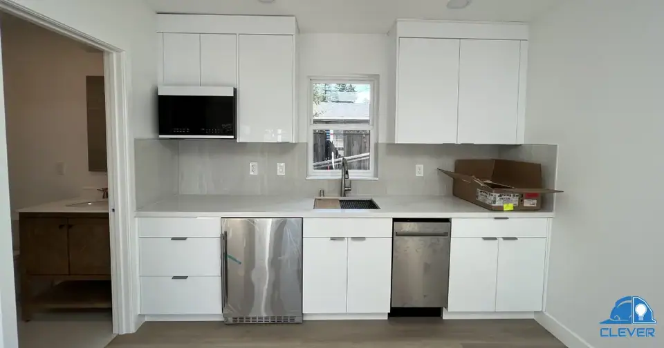 Interior of a small ADU featuring modern kitchen and bathroom