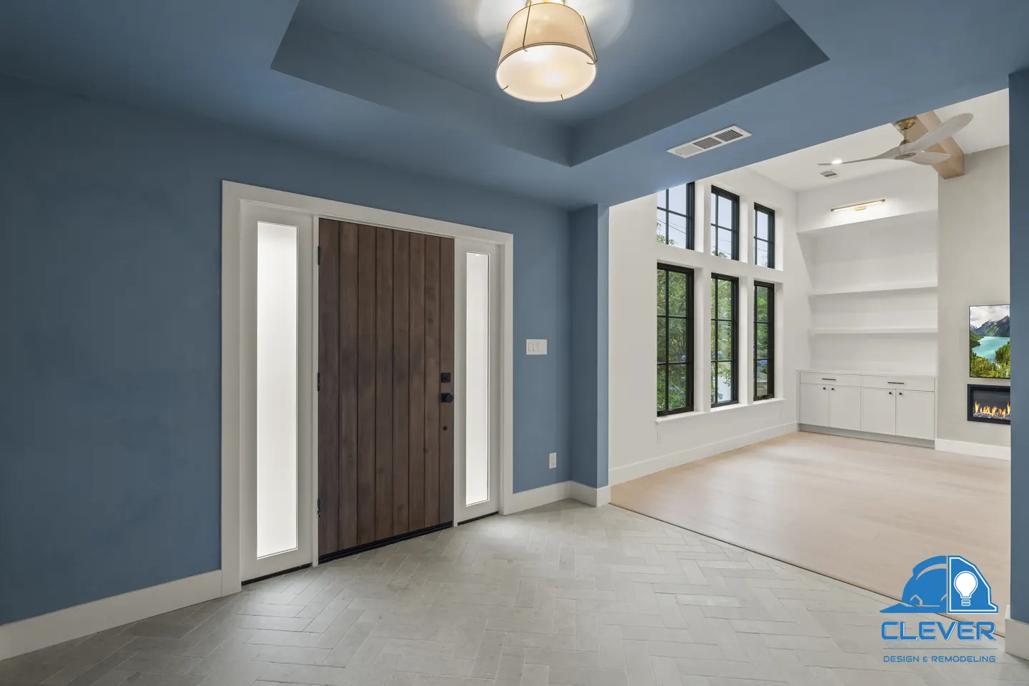 Blue entry with a tray ceiling, a plank wood front door and frosted sidelights, whole-home remodel in Palo Alto, CA